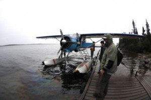 Float plane after we arrived back at the lodge, and after the cylinder blew.  Note the oil in the water.