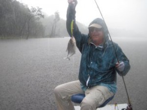 Mark showing a little rain can't stop him from catching piranhas.